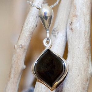 Amber & Silver. Elegant and dainty pendant. Cherry amber in sterling silver. Contemporary pendant. Small pendant. Unique jewelry. Amber.