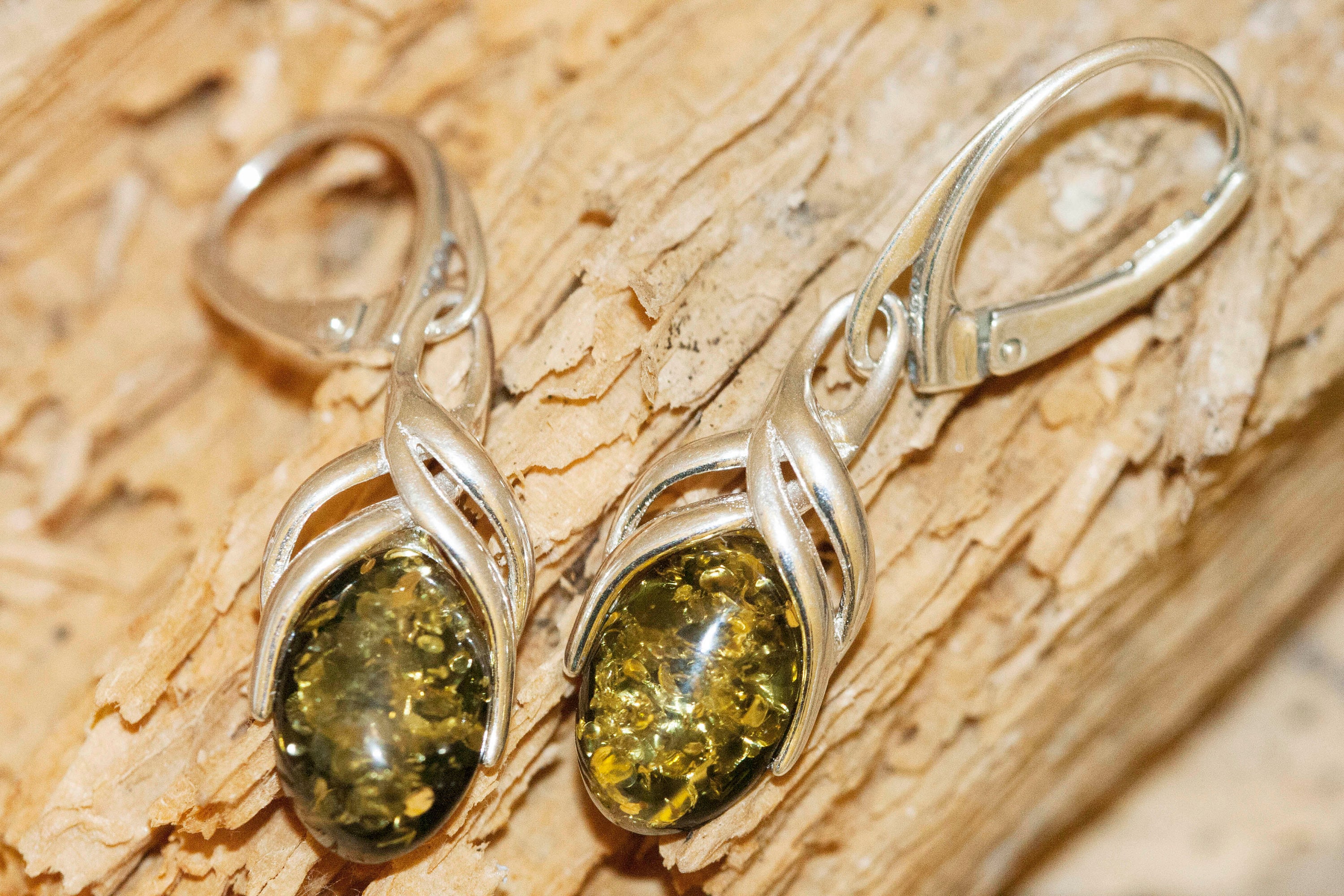 Green amber earrings. Sterling silver and green amber earrings. Dangle