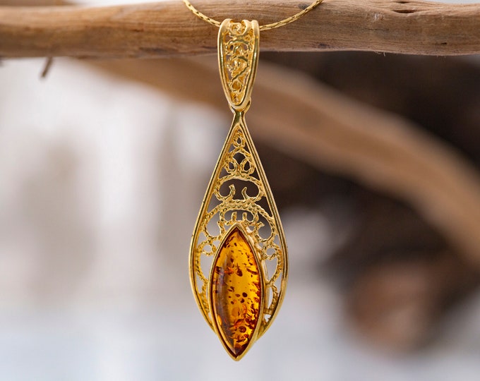 Amber and gold. Designer pendant. Amber pendant. Perfect gift. Celtic pendant. Contemporary pendant. Elegant pendant. Unique pendant.