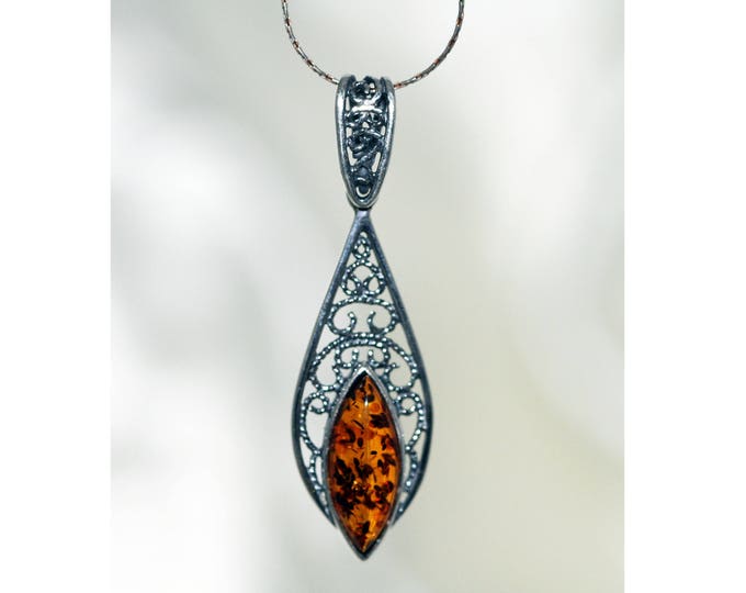 Celtic pendant viking wiccan. Amber Pendant in Sterling Silver. Contemporary pendant. Unusual pendant. Perfect gift. Unique. Celtic pendant.