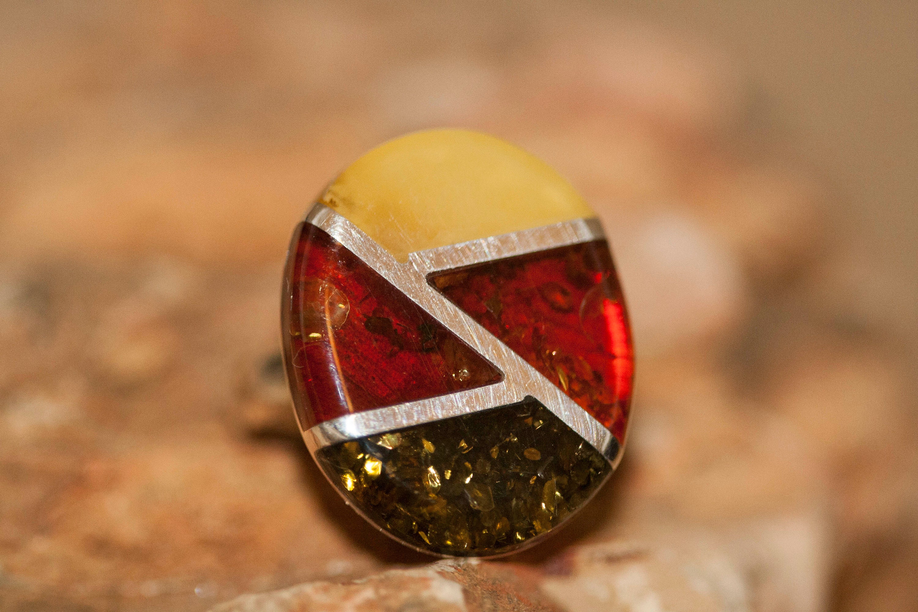 Large Baltic amber ring. Three kinds of amber shades fitted in sterling
