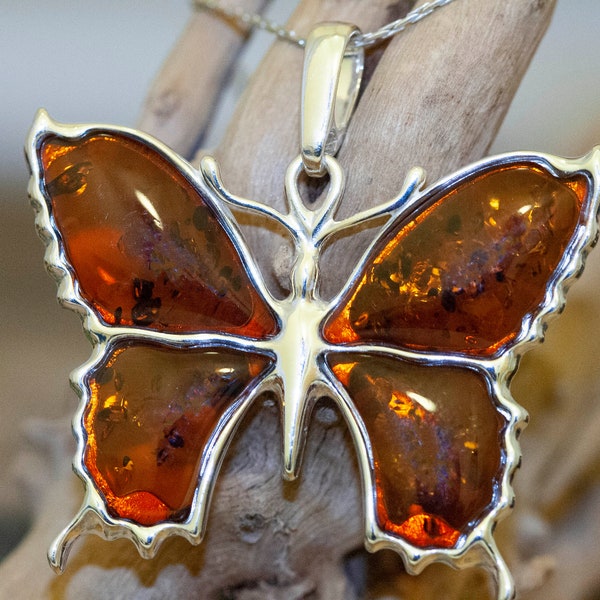 Amber & Silver. Four pieces of cognac Baltic amber. Butterfly shaped setting. Elegant pendant. Designer pendant. Contemporary design. Unique