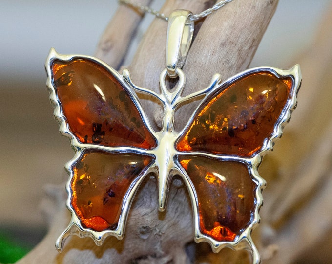 Amber & Silver. Four pieces of cognac Baltic amber. Butterfly shaped setting. Elegant pendant. Designer pendant. Contemporary design. Unique