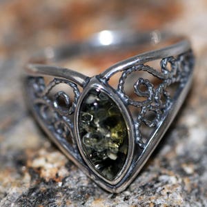 Baltic amber ring. Green kind of Baltic amber. Sterling silver setting. Perfect gift. Designer ring. Amber jewelry. Celtic design. Unique.