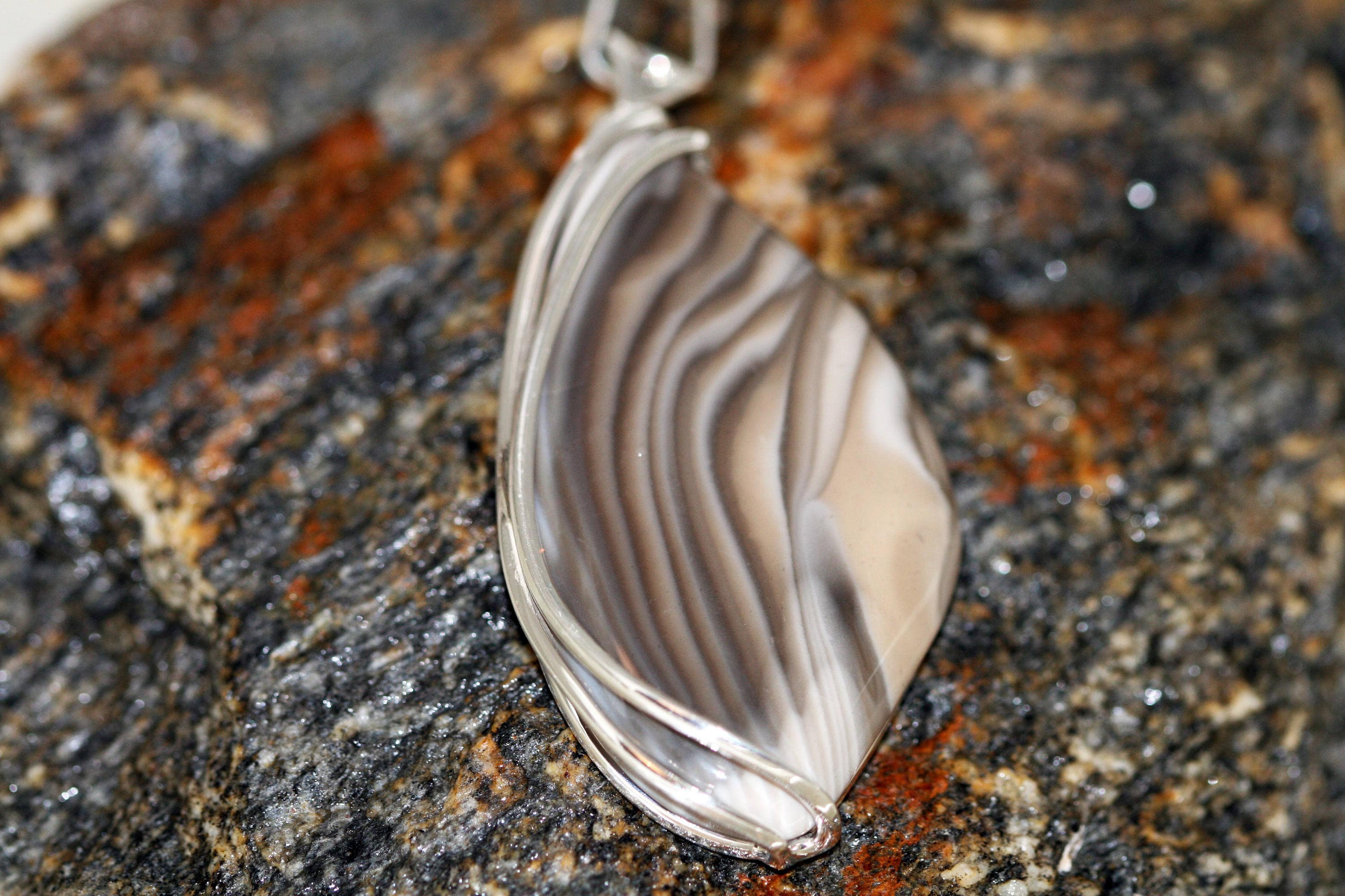 Striped Flint pendant fitted in sterling silver setting.