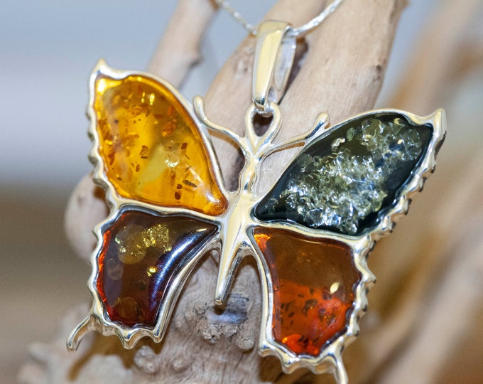 Amber & Silver. Four diferent kinds of Baltic amber. Butterfly shaped setting. Sterling silver. Amber jewelry. Contemporary design. Unique.