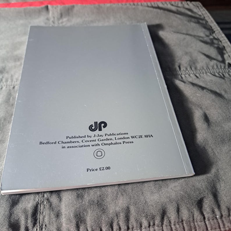 May include: A silver book with text from J-Jay Publications, Bedford Chambers, Covent Garden, London WC2E 8HA, in association with Omphalos Press. The price is listed as &pound;2.00.