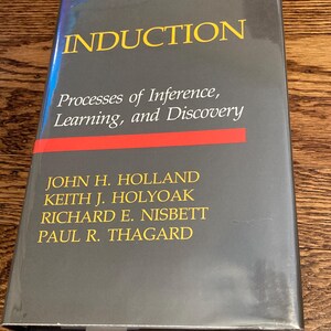 May include: A grey hardcover book titled "INDUCTION" with the subtitle "Processes of Inference, Learning, and Discovery." The cover features yellow and red text. The authors' names are listed below.
