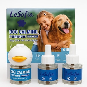 May include: A dog calming pheromone diffuser kit by LeSofia. The kit includes a duck-shaped diffuser and two bottles of pheromone solution. The packaging features a girl hugging a golden retriever. The bottles contain 49ml/1.6 fl oz.