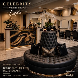 May include: A luxurious black leather circular sofa with button tufting and gold trim. The sofa is adorned with black and patterned throw pillows. The image includes the text "CELEBRITY FURNISHINGS Luxe" and "DESIGNED TO IMPRESS. MADE TO LAST."