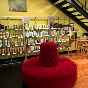Round bench in pink velvet for a hair, beauty salon living room decor