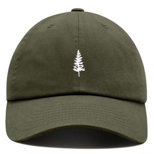 May include: A green baseball cap with a white embroidered pine tree design.