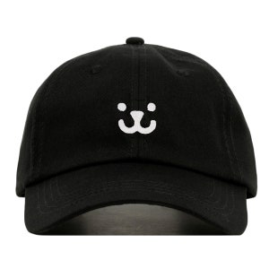 May include: A black baseball cap with a white embroidered smiley face.