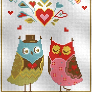 May include: Cross-stitch artwork featuring two owls, one blue and one red, with hearts and butterflies. The owls are adorned with hats and bow ties, set against a white background with a decorative border. A charming, handcrafted piece.