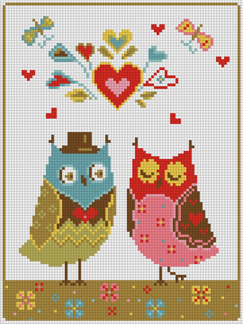 May include: Cross-stitch artwork featuring two owls, one blue and one red, with hearts and butterflies. The owls are adorned with hats and bow ties, set against a white background with a decorative border. A charming, handcrafted piece.