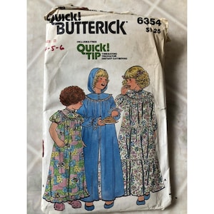 May include: Vintage Butterick sewing pattern packet. The packet features an illustration of three children in nightgowns and robes. The packet includes the text "Quick! Butterick" and "Quick! Tip". The pattern number is 6354.