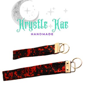 Llavero de pulsera con salpicadura de sangre gótica