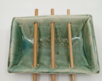 Pale green handmade ceramic and bamboo soap dish