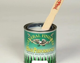 May include: A white can of General Finishes High Performance Water Based Topcoat with a wooden stir stick in the can. The can has a green label with a white eagle and the words "General Finishes" and "High Performance" in a green and white banner.