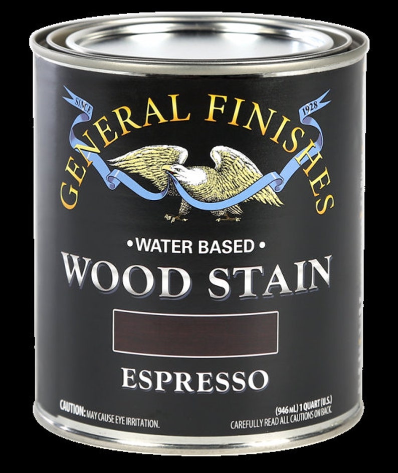 May include: A can of General Finishes Espresso Wood Stain. The can is black with gold lettering and an eagle logo. It is water-based and contains 1 quart (946 ml).