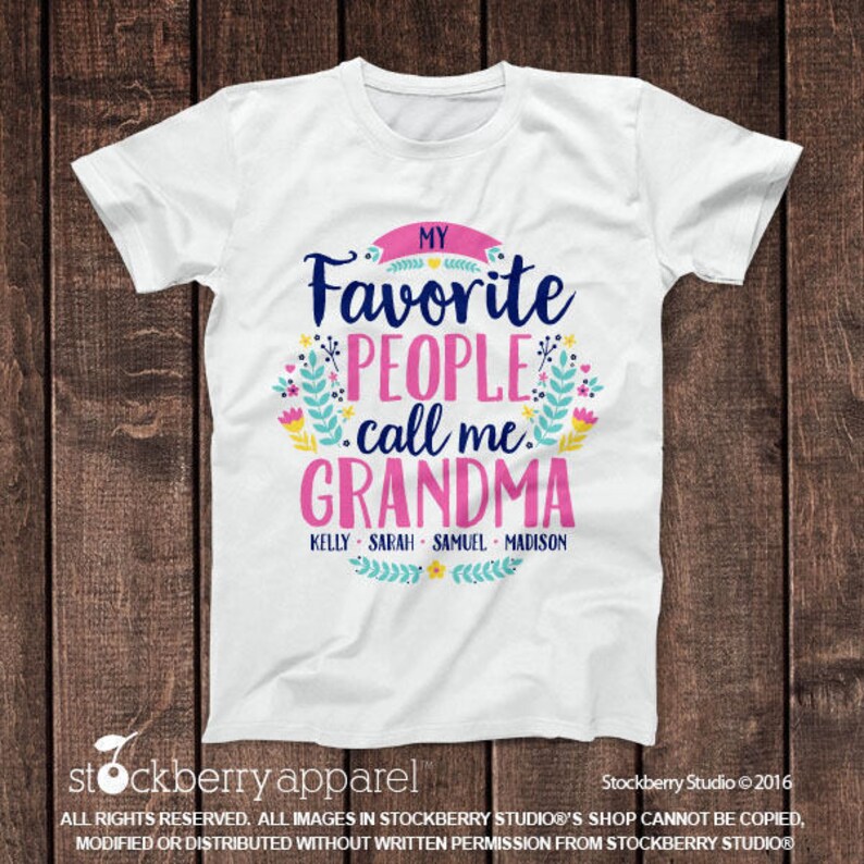 May include: White t-shirt with a pink, blue, and green floral design. The text "My Favorite People Call Me Grandma" is written in black. The names "Kelly, Sarah, Samuel, Madison" are written in black below the text.