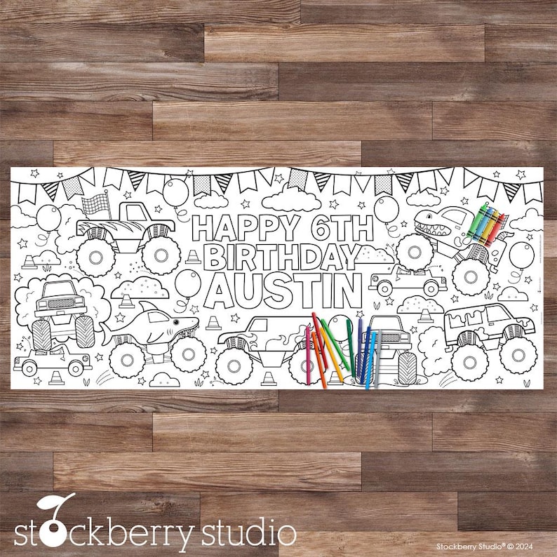 May include: A black and white coloring page featuring monster trucks, a dinosaur, and the text "HAPPY 6TH BIRTHDAY AUSTIN".