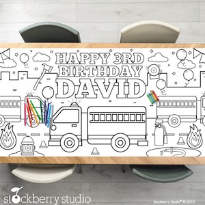 May include: A black and white coloring table cover featuring a fire truck theme. The cover includes the text "Happy 3rd Birthday David".