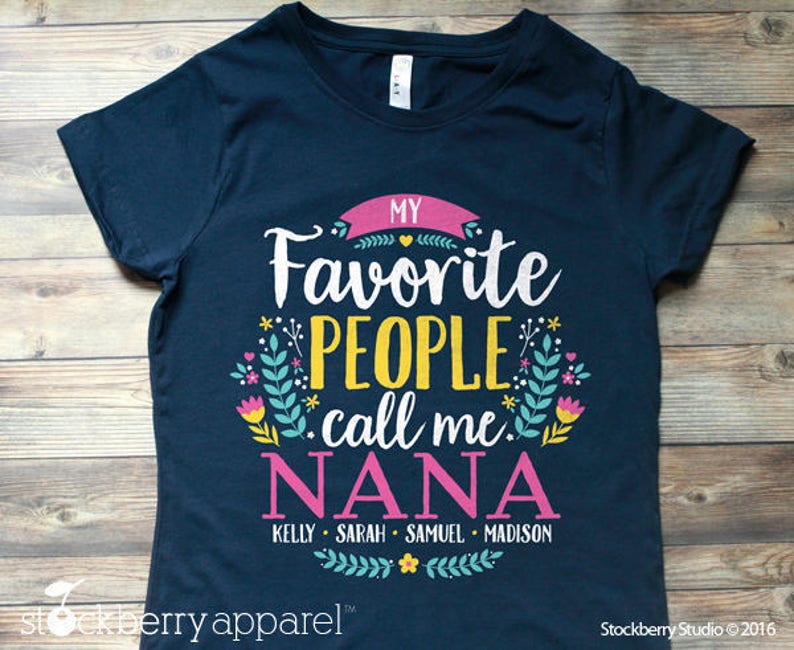 May include: Navy blue t-shirt with a floral design and the text "My Favorite People Call Me Nana" with the names Kelly, Sarah, Samuel, and Madison listed below.