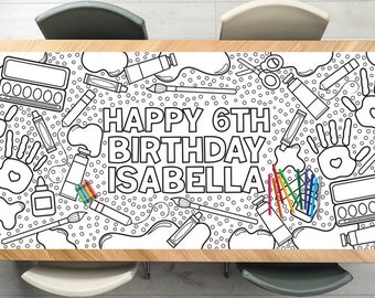 May include: A black and white coloring table runner featuring art supplies and the text "Happy 6th Birthday Isabella".