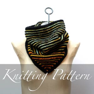 May include: Knitting pattern for a black, green, and orange striped cowl with a geometric design. The cowl is displayed on a white dress form.