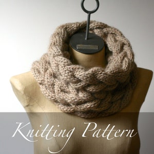 May include: A brown knitted cowl neck scarf with a cable knit pattern.