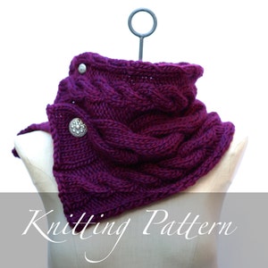 May include: A purple knitted cowl with a cable knit pattern and two silver buttons. Knitting Pattern.