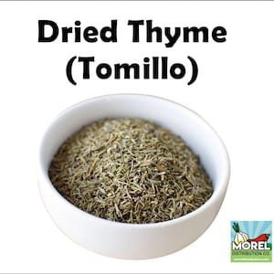 May include: A white bowl filled with dried thyme, also known as "Tomillo". The bowl is on a white background with the text "Dried Thyme (Tomillo)" above it. The Morel Distribution Co. logo is in the lower right corner.