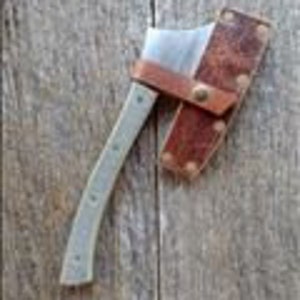 May include: A small, hand-forged axe with a wooden handle and a leather sheath. The axe has a curved blade and a brass rivet on the sheath.