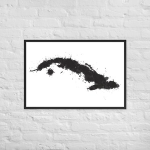 May include: A black and white watercolour painting of the island of Cuba. The island is depicted in a stylised, abstract way, with splashes of black paint representing the coastline and interior.