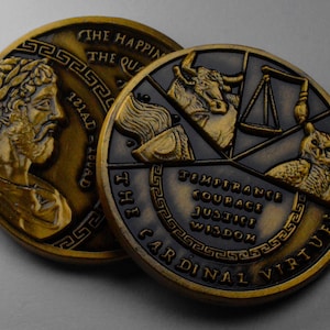 May include: Two gold-toned metal coins with raised edges. The first coin features a profile of a man with a laurel wreath on his head. The second coin features four symbols representing the cardinal virtues: temperance, courage, justice, and wisdom. The text "THE CARDINAL VIRTUES" is inscribed around the edge of the coin.