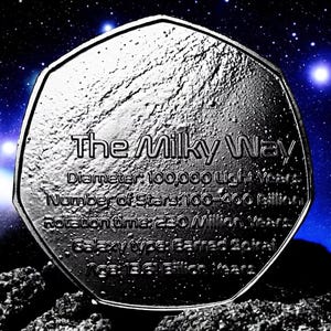 May include: A silver coin with the text "The Milky Way" and information about the galaxy, including its diameter, number of stars, rotation time, and galaxy type. The coin is set against a dark blue background with white stars.