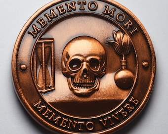 May include: A copper-colored coin with the Latin phrase "Memento Mori" and "Memento Vivere" inscribed around the edge. The coin features a skull, an hourglass, and a bomb with a lit fuse.