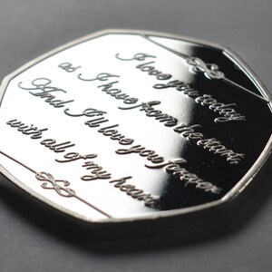 May include: A silver coin with the inscription "I love you today as I have from the start, And I'll love you forever with all of my heart".