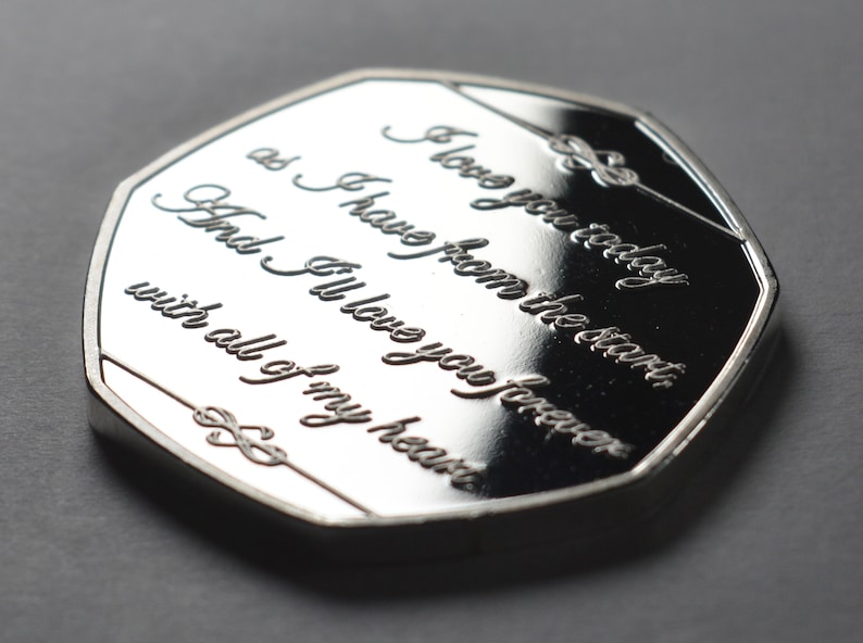 May include: A silver coin with the inscription "I love you today as I have from the start, And I'll love you forever with all of my heart".