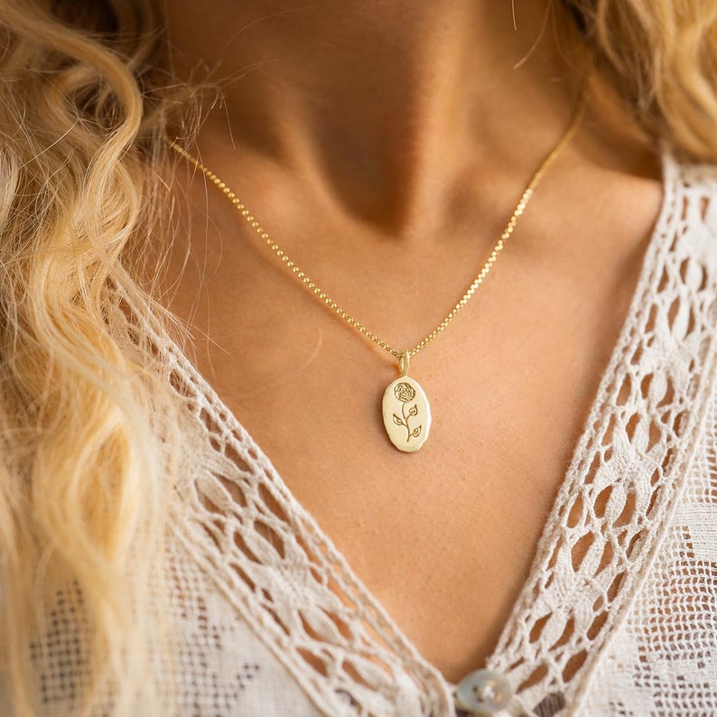 Model wearing a Gold Plated Sterling Silver Oval Birth Flower Personalised Necklace