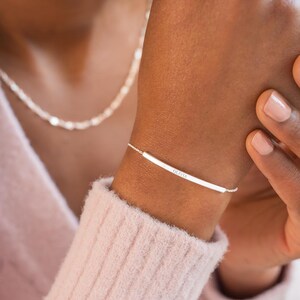 Silver Bracelet Model Shot with Name Engraving Reading Olivia