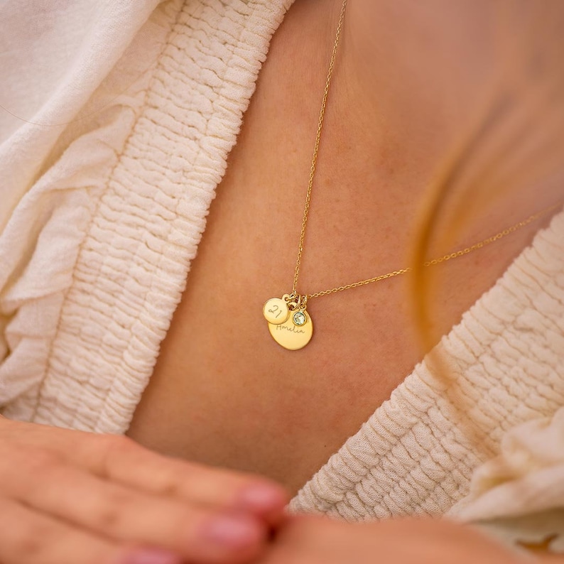 gold plated sterling silver birthday disc necklace personalised with a contemporary script name and age