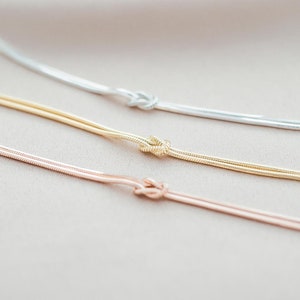 Three Sterling Silver Infinity Knot Personalised Bracelets, one Rose Gold, one Gold and one Silver