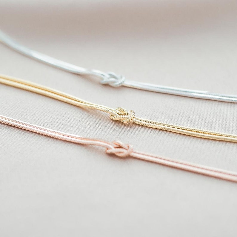 Three Sterling Silver Infinity Knot Personalised Bracelets, one Rose Gold, one Gold and one Silver