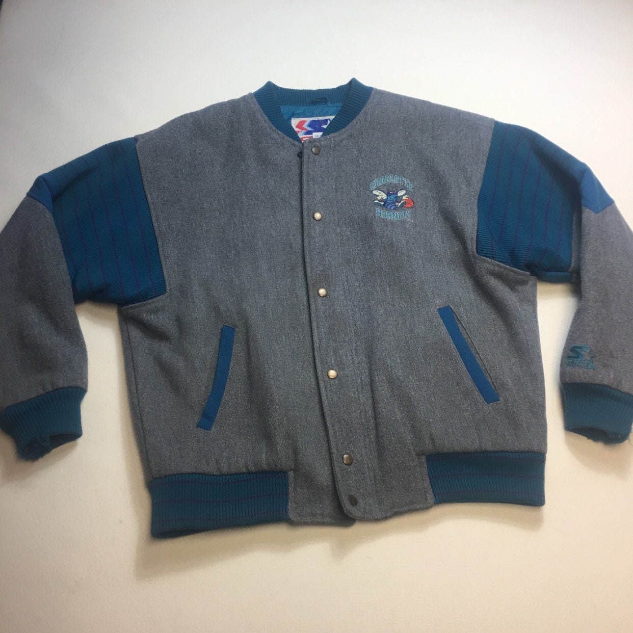 90s Charlotte Hornets jacket by Starter worn by J.Cole on the instagram  account @dadomdahdahdahdah
