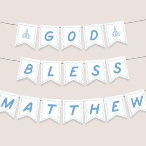 May include: A white banner with blue lettering that reads "GOD BLESS MATTHEW". The banner is strung up with a church icon on each end.
