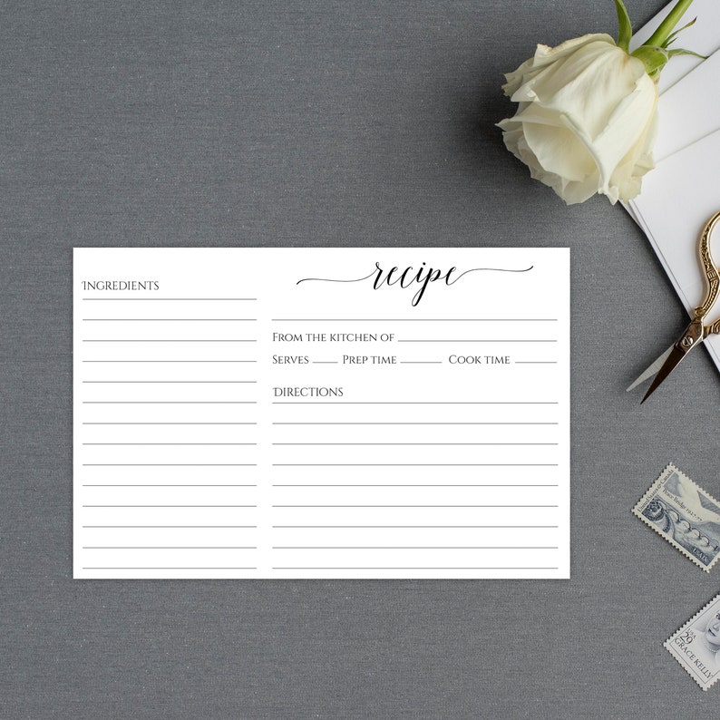 May include: A blank white recipe card with the word "recipe" written in cursive at the top. The card has sections for ingredients, directions, from the kitchen of, serves, prep time, and cook time.