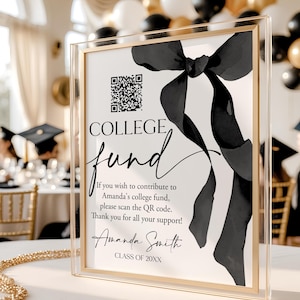 May include: A clear acrylic sign with a gold frame, featuring the words "COLLEGE fund" in elegant script. A black watercolor bow design adorns the right side. The sign includes a QR code and text inviting contributions to Amanda's college fund.