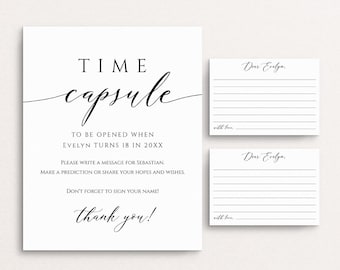 May include: A white card with black text that says "TIME capsule" and "TO BE OPENED WHEN EVELYN TURNS 18 IN 20XX".  The card also includes instructions to write a message for Sebastian, make a prediction, or share hopes and wishes.  The card ends with "DON'T FORGET TO SIGN YOUR NAME!" and "thank you!"
